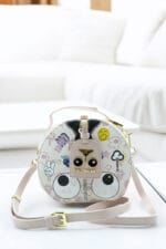 Sac bandoulière rond design ludique